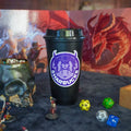 Black 'Sharbucks' coffee cup with fantasy-themed background featuring dice and miniatures.